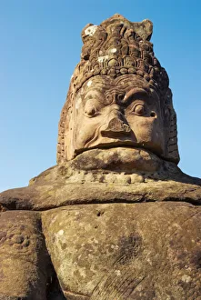 Stone statue at the entrance to Bayon temple Stone statue at the entrance to Bayon temple