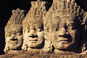 Stone statues at the entrance to Bayon temple Stone statues at the entrance to Bayon temple