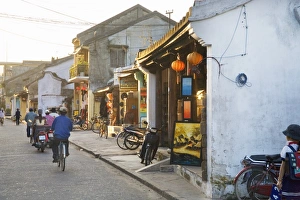 Street with shops and people in Vietnamese town Street with shops and people in Vietnamese town