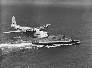 Sunderland Bomber in a mock bombing practice with the Queen Elizabeth Sunderland Bomber in a mock bombing practice with the Queen Elizabeth