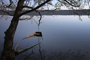 A sunken rowing boat in the lake of Moryn, Poland, Europe A sunken rowing boat in the lake of Moryn, Poland, Europe