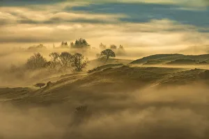 Sunrise above fog with a Lake District landscape, UK Sunrise above fog with a Lake District landscape, UK