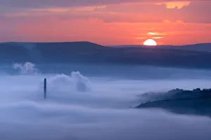 Sunrise over a foggy Castleton, English Peak District. UK Sunrise over a foggy Castleton, English Peak District. UK