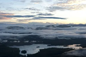 Sunrise over the mountains, cloudy sky above Maskeliya Reservoir, view from Adams Peak Sunrise over the mountains, cloudy sky above Maskeliya Reservoir, view from Adams Peak