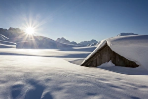 Sunrise on Sennes Alm at the Sennes refuge in the Fanes-Sennes-Prags Nature Park in Sunrise on Sennes Alm at the Sennes refuge in the Fanes-Sennes-Prags Nature Park in