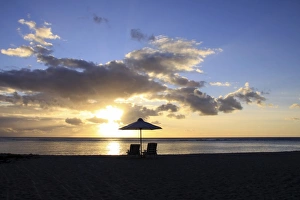 Sunset on the public beach of Flic en Flac on the western coast of Mauritius, Africa Sunset on the public beach of Flic en Flac on the western coast of Mauritius, Africa