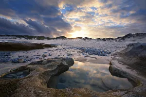 Sunset reflection in a water puddle - Arniston, South Africa Sunset reflection in a water puddle - Arniston, South Africa