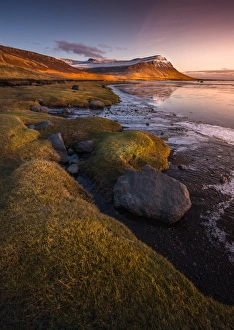 Sunset at Rock beach in West fjord Iceland Sunset at Rock beach in West fjord Iceland