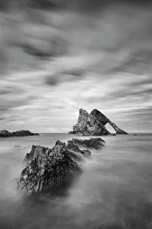 Sunset with smooth water at bow fiddle rock near Portknockie - Scotland Europe Sunset with smooth water at bow fiddle rock near Portknockie - Scotland Europe