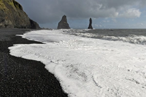 Surf on the black lava beach of Reynisfjara, Reynisdrangar Pinnacles, near Vik i Myrdal Surf on the black lava beach of Reynisfjara, Reynisdrangar Pinnacles, near Vik i Myrdal