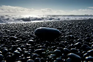 Surf, black pebbles on the lava beach of Reynisfjara near Vik i Myrdal, South Coast Surf, black pebbles on the lava beach of Reynisfjara near Vik i Myrdal, South Coast
