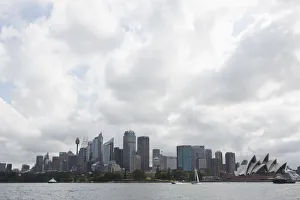 Sydney opera house and skyline against cloudy sky, Australia Sydney opera house and skyline against cloudy sky, Australia