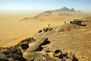 Tourists Overlooking a Vast Desert Landscape Tourists Overlooking a Vast Desert Landscape
