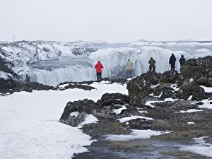 Tourists taking pictures of the Godafoss waterfall, Godafoss, Gemeinde Pingeyjarsveit Tourists taking pictures of the Godafoss waterfall, Godafoss, Gemeinde Pingeyjarsveit