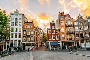 Traditional Dutch old houses in Amsterdam at sunset, Netherlands Traditional Dutch old houses in Amsterdam at sunset, Netherlands