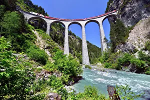 A train of the Rhaetian Railway on the Landwasser Viaduct, UNESCO World Heritage Site A train of the Rhaetian Railway on the Landwasser Viaduct, UNESCO World Heritage Site