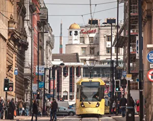 A tram leaving Piccadilly Gardens, Manchester A tram leaving Piccadilly Gardens, Manchester