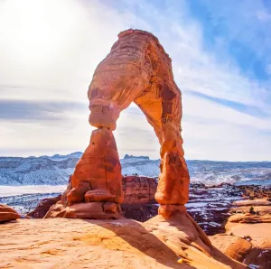 Prints of Delicate Arch at Arches National Park. This is a very popular tourist attraction in southeastern Utah. This is a paradise for outdoors enthusiast seeking challenging hikes in a dry arid landscape Travel Imagery Prints: Delicate Arch at Arches National Park - Utah Winter Print