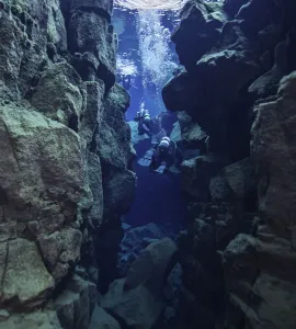 Prints of A group of scuba divers traverse the Silfra Fissure Travel Imagery Prints: Silfra Fissure Scuba Divers Print