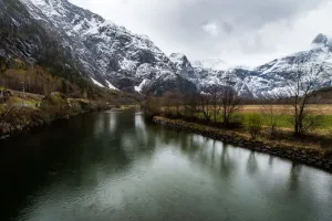 Prints of River with snow-covered mountains in the background, reflections Travel Imagery Prints: Rauma River Print with Snow-Covered Mountains