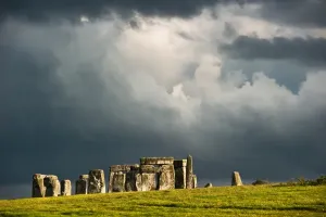 Prints of Late afternoon sun shines on Stonehenge after a short October rain storm over the ancient site Salisbury Prints: Late Afternoon Sun on Stonehenge Print