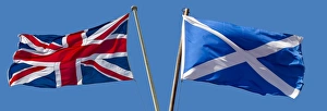 The Union Flag and the Scottish flag, Saltire, blowing in opposite directions The Union Flag and the Scottish flag, Saltire, blowing in opposite directions