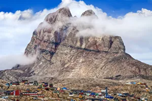 Uummannaq mountain (1170 m, 3839 ft.) over fishing village, Uummannaq, Greenland Uummannaq mountain (1170 m, 3839 ft.) over fishing village, Uummannaq, Greenland