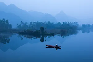 Vietnam - Farmer go to market by boat on Suoi Yen river in early morning at My Duc Vietnam - Farmer go to market by boat on Suoi Yen river in early morning at My Duc