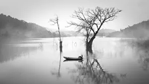 Vietnam - landscape of fishing boat on lake in Lao Cai Vietnam - landscape of fishing boat on lake in Lao Cai