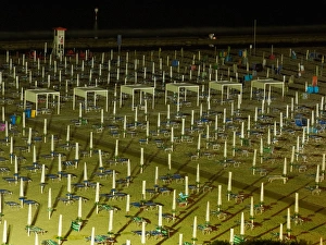 View of the beach at night with closed parasols and sun loungers, Lignano Sabbiadoro View of the beach at night with closed parasols and sun loungers, Lignano Sabbiadoro