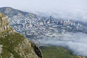 View of clouds rolling over downtown from Devils Peak, Table Mountain National Park View of clouds rolling over downtown from Devils Peak, Table Mountain National Park