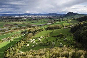 View from Hohenkraehen Mountain over the spring-like Hegau landscape, Hohentwiel Mountain on the horizon View from Hohenkraehen Mountain over the spring-like Hegau landscape, Hohentwiel Mountain on the horizon