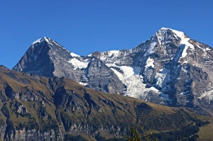 View of the mountains Eiger and Moench from Grutsch Alp near Muerren, Bernese Oberland View of the mountains Eiger and Moench from Grutsch Alp near Muerren, Bernese Oberland