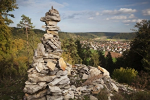 View past a cairn towards Dietfurt from Hirschblick lookout, Dietfurt, Bavaria, Germany View past a cairn towards Dietfurt from Hirschblick lookout, Dietfurt, Bavaria, Germany
