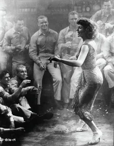 Prints of Rita Hayworth dancing for a crowd of military men in a scene from the film Miss Sadie Thompson, 1953. (Photo by Columbia Pictures/Getty Images) Rita Prints: Rita Hayworth Print - Miss Sadie Thompson Scene, 1953