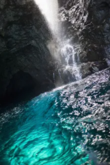 Waiahuakua sea cave explored on boat tour of Na Pali Coast, Kauai, Hawaii, USA Waiahuakua sea cave explored on boat tour of Na Pali Coast, Kauai, Hawaii, USA