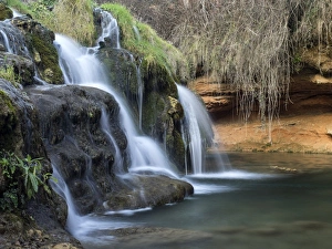 Water jets of a cataract in a ravine Water jets of a cataract in a ravine