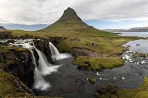 Waterfall near Grundarfjordur, Kirkjufell at the back, Snaefellsnes peninsula, Iceland Waterfall near Grundarfjordur, Kirkjufell at the back, Snaefellsnes peninsula, Iceland