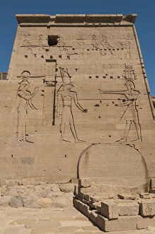Well-preserved carved relief of the pylon at the Temple of Isis in Philae Well-preserved carved relief of the pylon at the Temple of Isis in Philae