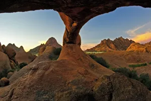 Two Windows To One World - Landscape photo of the Natural rock arch at Spitzkoppe in the Two Windows To One World - Landscape photo of the Natural rock arch at Spitzkoppe in the