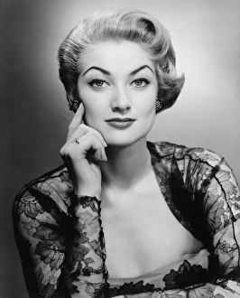 Woman in evening dress posing in studio (B&W), portrait Woman in evening dress posing in studio (B&W), portrait