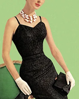 Woman wearing black dress and pearl necklace Woman wearing black dress and pearl necklace