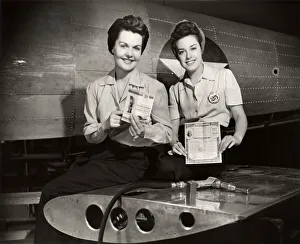 WW II aircraft workers holding savings bonds WW II aircraft workers holding savings bonds