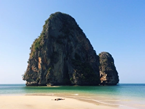 Young man chilling on the Phra Nang beach, Thailan Young man chilling on the Phra Nang beach, Thailan