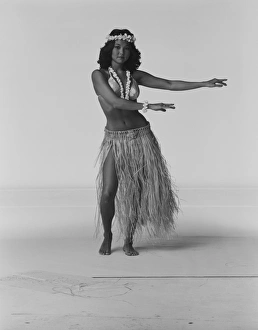 Young woman hula dancer dancing on white background, portrait Young woman hula dancer dancing on white background, portrait