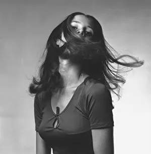 Young woman shaking head in studio, (B&W), portrait Young woman shaking head in studio, (B&W), portrait