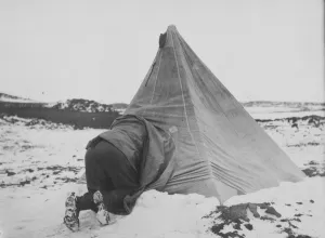 Dr Edward Wilson entering his tent at Cape Royds Dr Edward Wilson entering his tent at Cape Royds