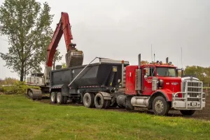 A 6x4 red Kenworth atic unit with a twin axle tipping trailer being loaded at Sudbury A 6x4 red Kenworth atic unit with a twin axle tipping trailer being loaded at Sudbury
