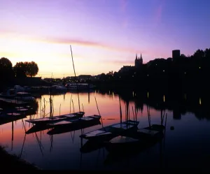 Boats at sunset. Angers, on the banks of the river Maine, Loire Valley. France Boats at sunset. Angers, on the banks of the river Maine, Loire Valley. France