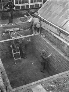 Building the outer foundations for an air raid shelter in a garden in Hextable Building the outer foundations for an air raid shelter in a garden in Hextable